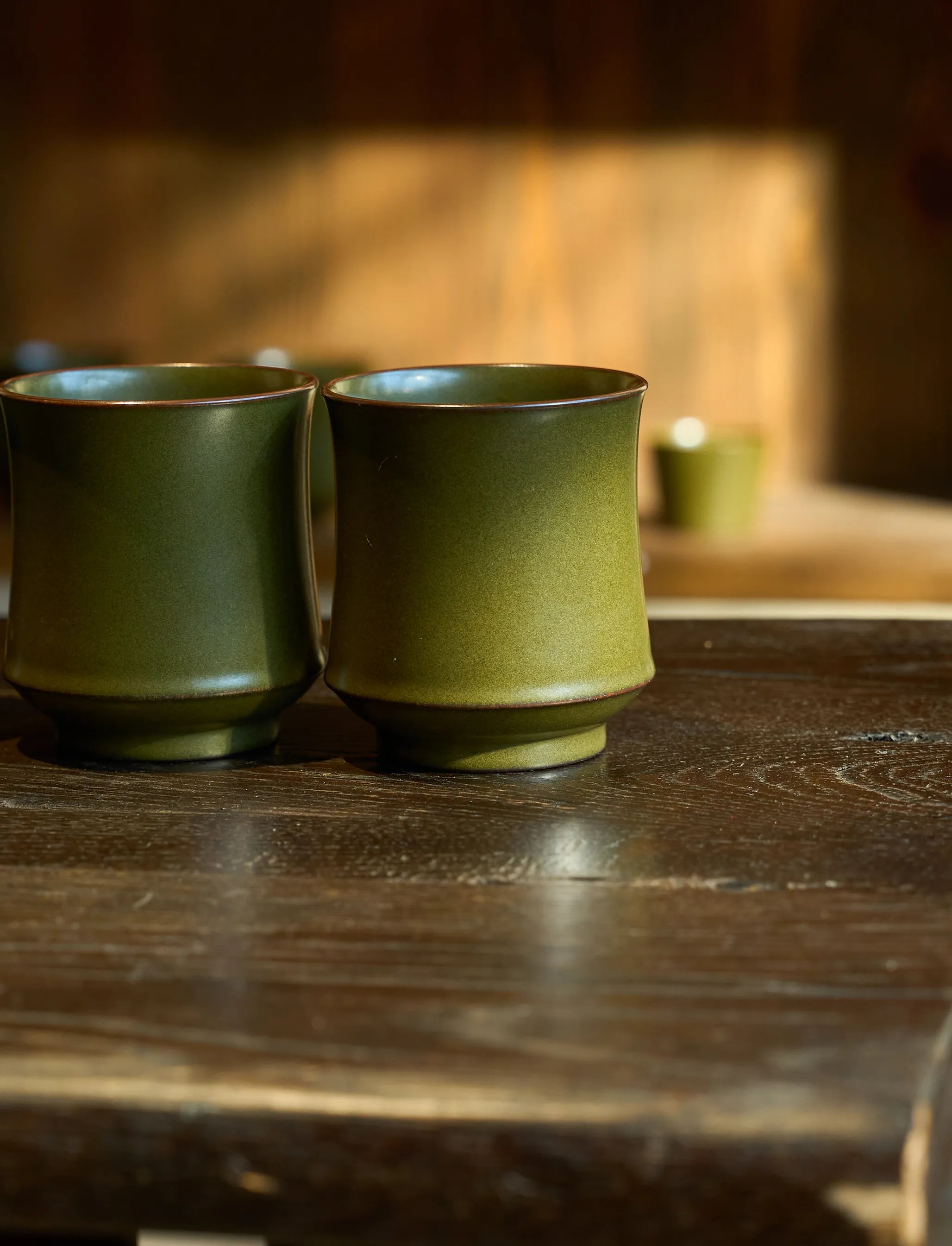 Side profile of Saragaia Tea Dust glaze mug, showing the ergonomic silhouette and bamboo handle