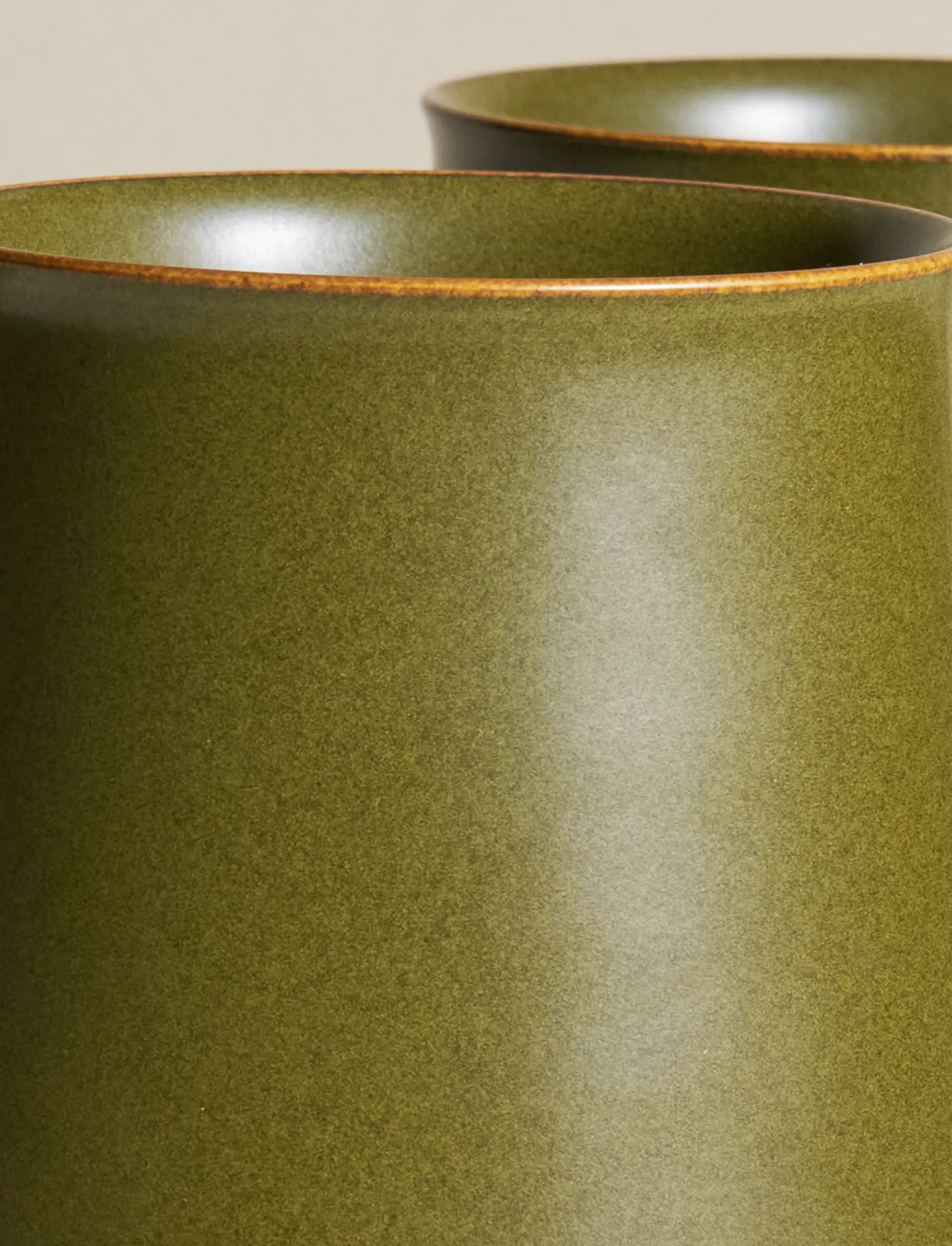 Macro shot of SaraGaia mug rim. Fine Tea-Dust glaze mineral texture.