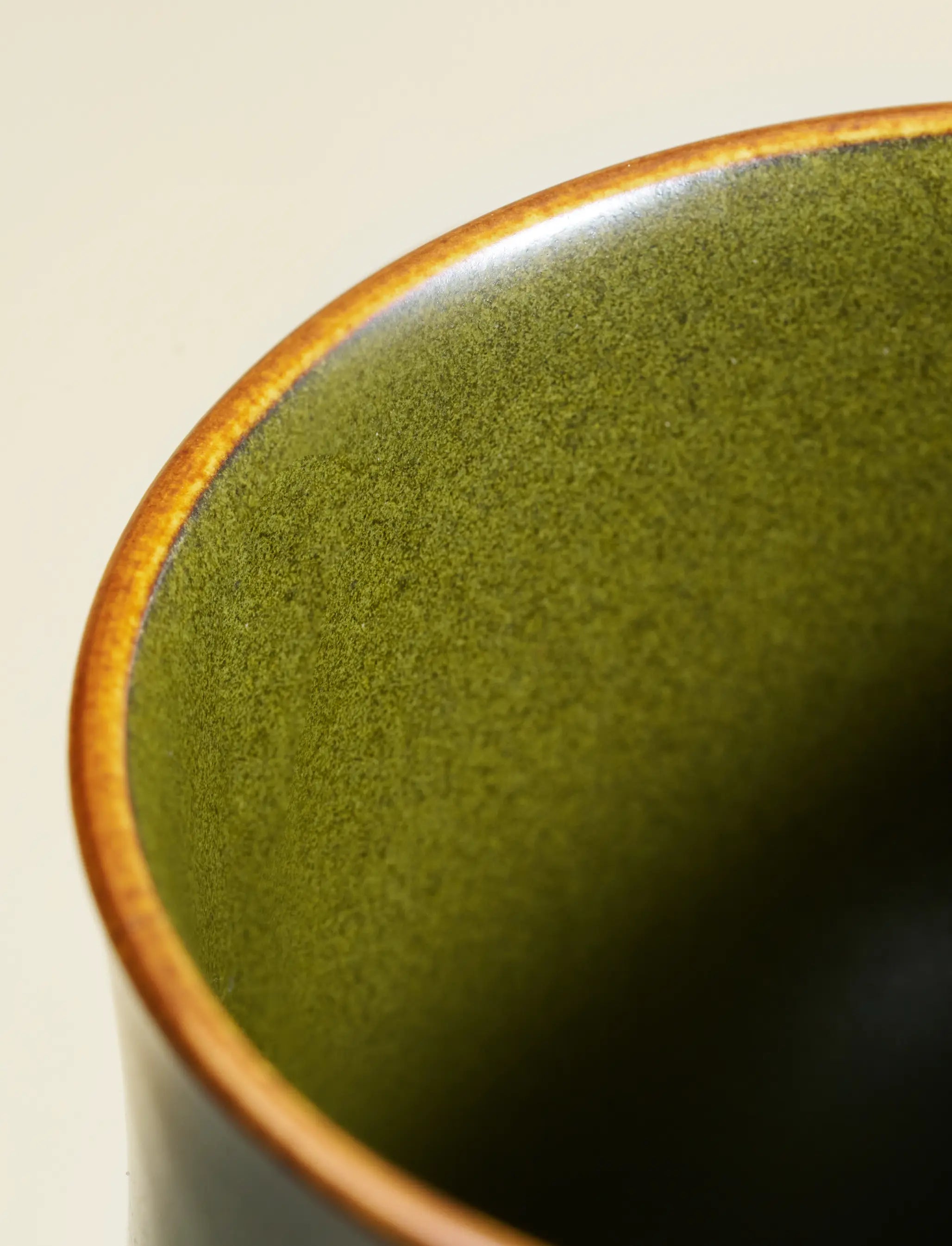 Macro shot of SaraGaia vase rim. Fine Tea-Dust glaze mineral texture.