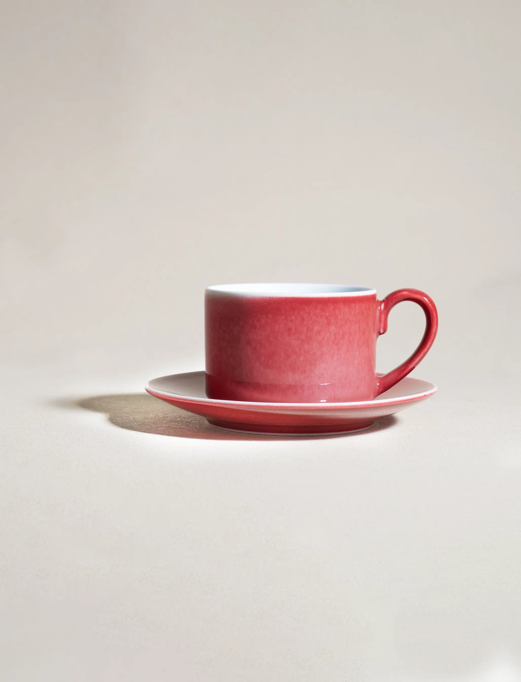SaraGaia peach blossom cup and saucer set. Elegant red to white gradient.