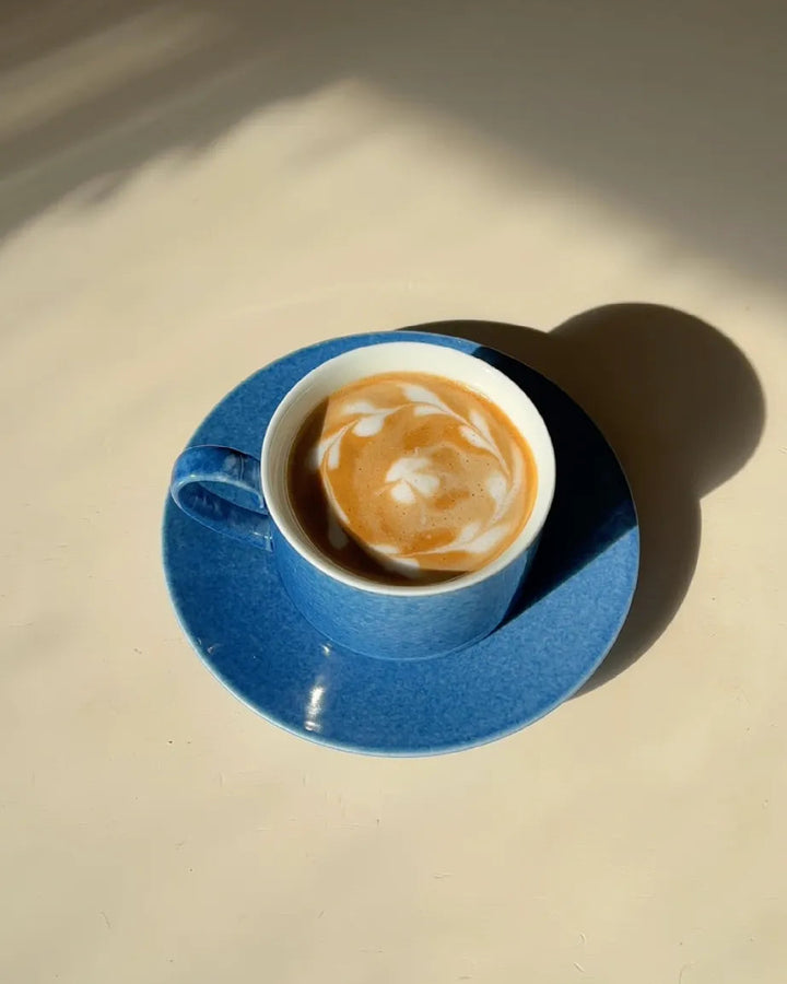 A coffee ritual, colored by the depth of the ocean.