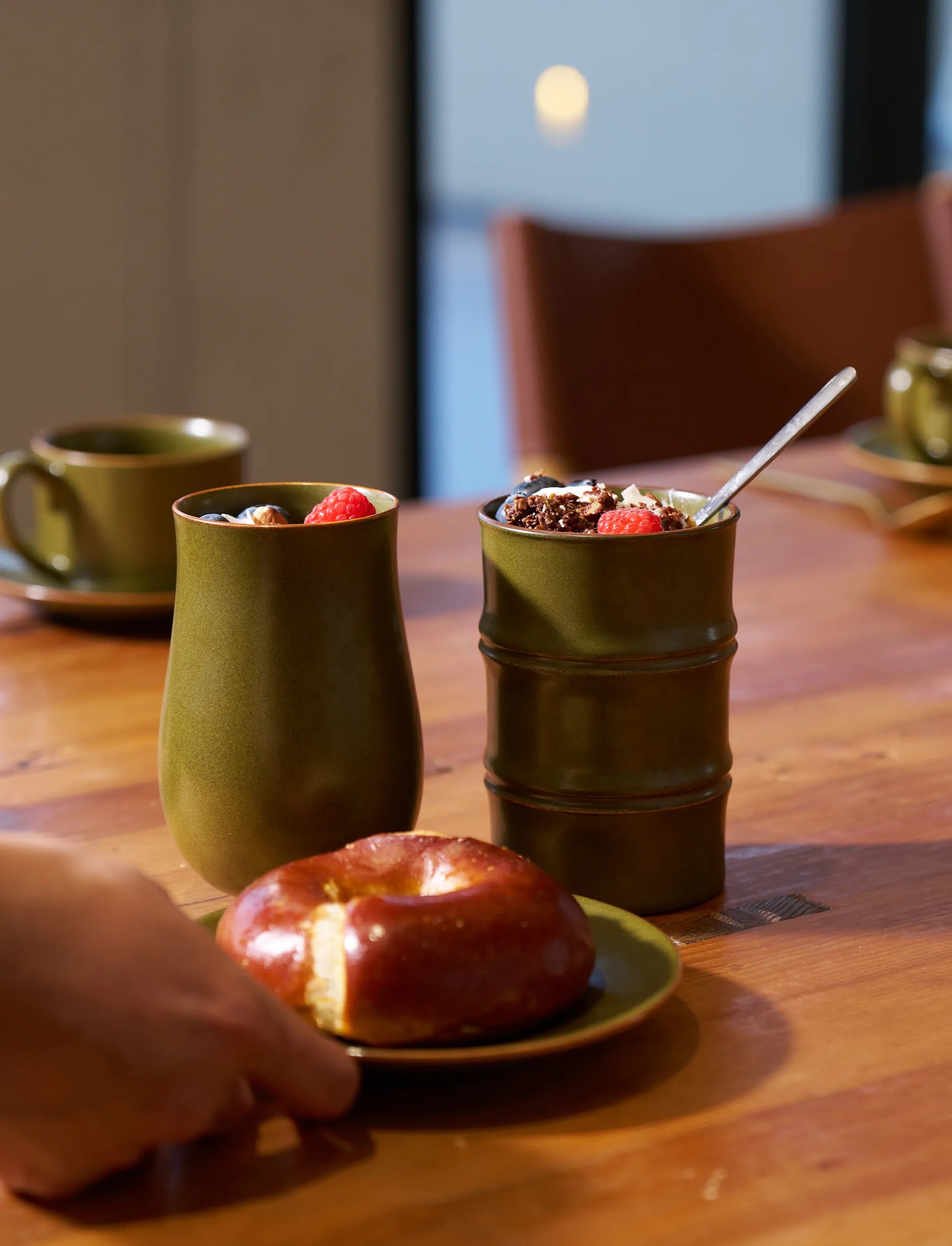 Row of five minimalist Tea-Dust Glaze porcelain tasting cups, showcasing the bamboo-joint inspired design and vintage matte finish. Handcrafted by Master Zhiyin in Jingdezhen, these artisanal cups reflect the 72-step creation process.