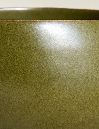 Macro view of SaraGaia Tea-Dust glaze. Unique high-fire mineral speckles