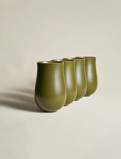 Four SaraGaia curvy tall cups stacked. Unique mineral glaze finish.