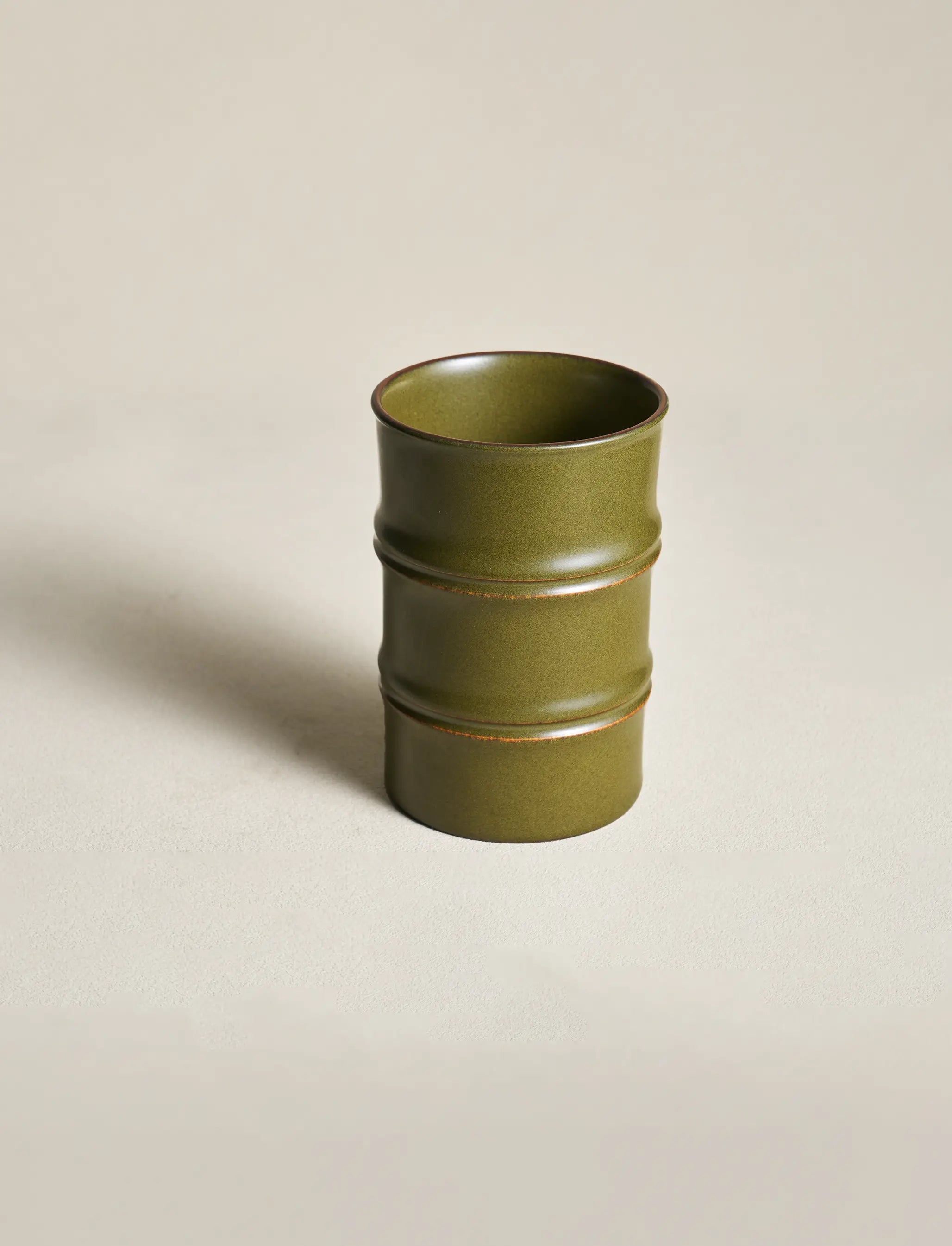 A clean, centered view of the SaraGaia Tea-Dust Glaze tall cup, showcasing the realistic bamboo joint texture and the unique variations of the high-fire artisanal glaze.