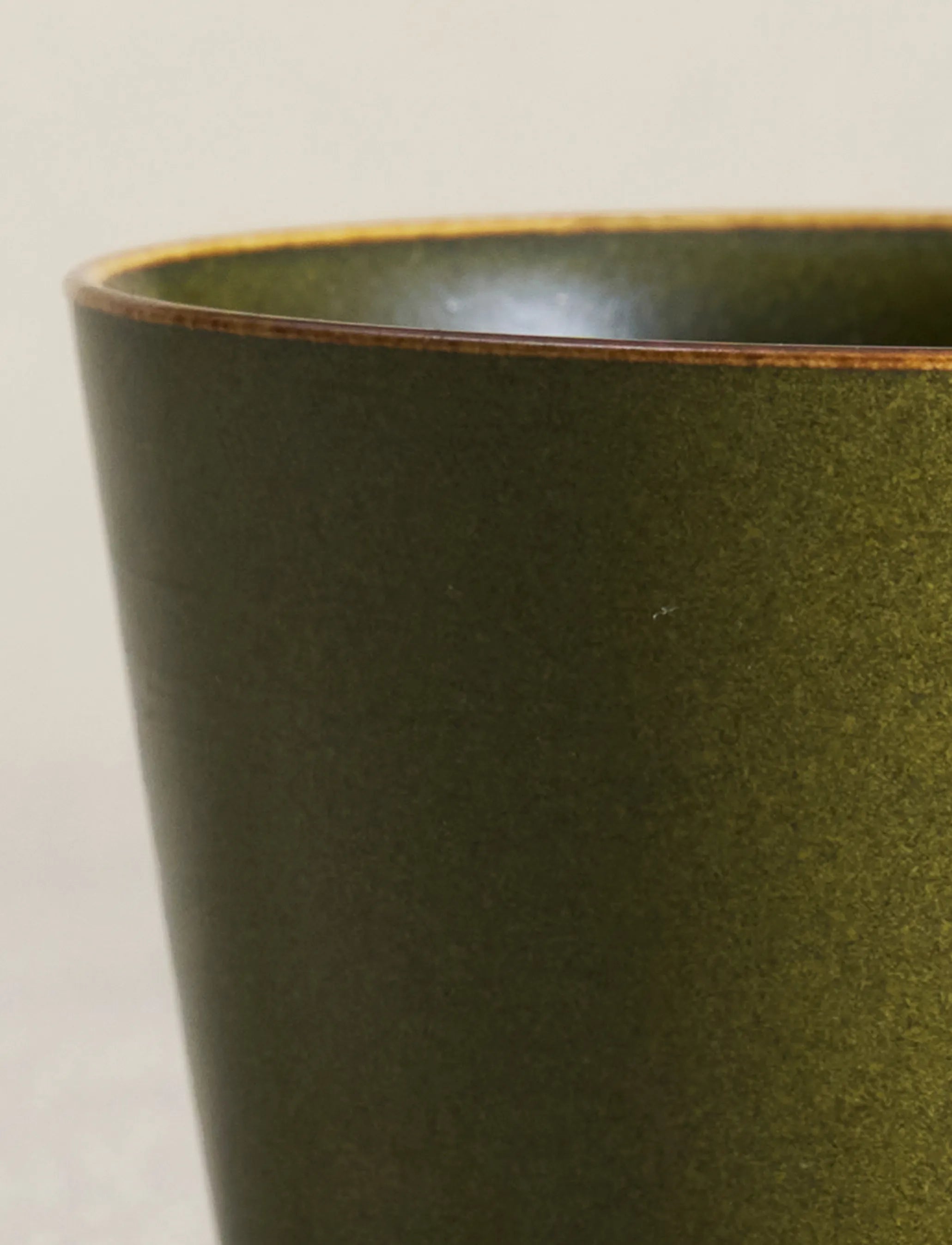 Macro shot of SaraGaia cup rim. Fine Tea-Dust glaze mineral texture.