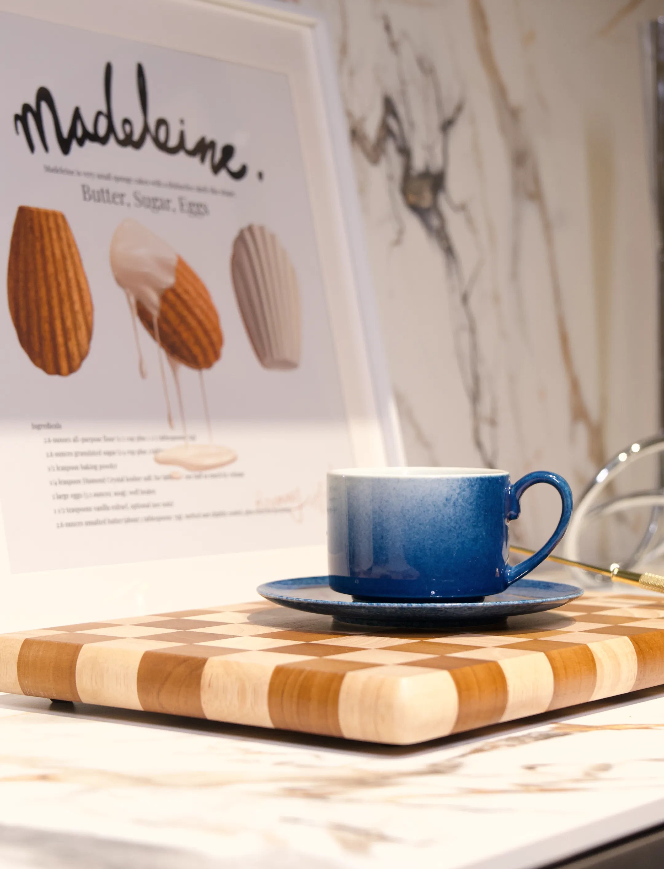 Close-up shot of a master-made Saragaia sprinkling blue ceramic espresso cup and saucer set, showcasing the intricate blue and white pattern and smooth glaze