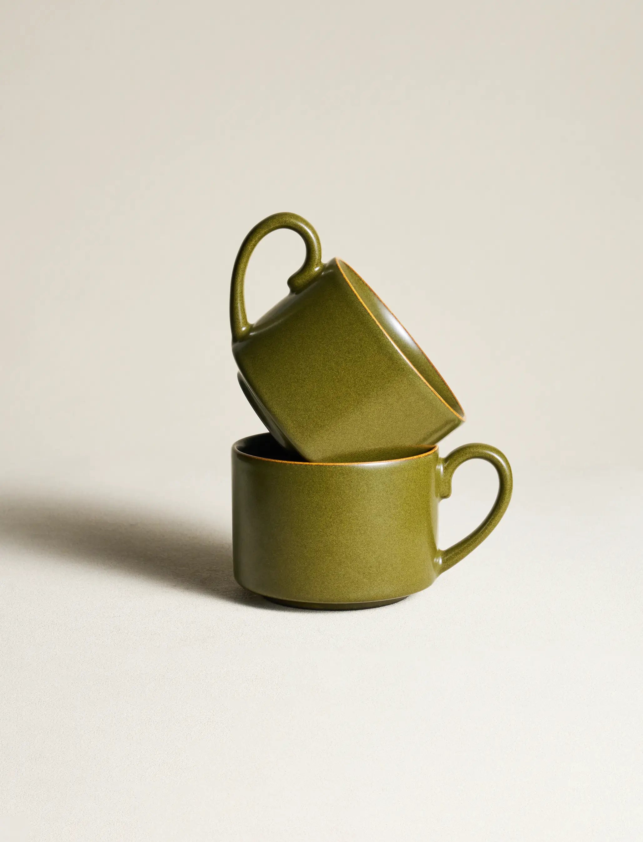 Two SaraGaia espresso cups stacked. Handcrafted mineral glaze finish.