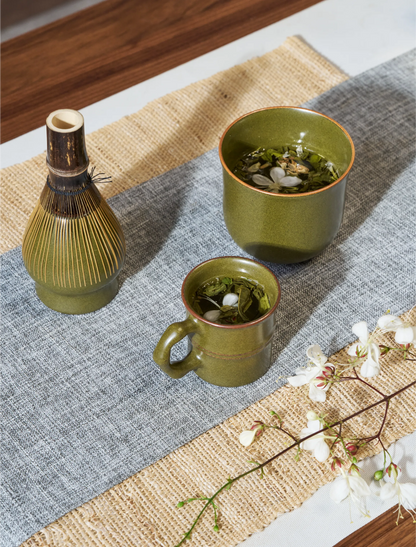 SaraGaia tea set on a blue runner. Traditional Matcha ritual scene.