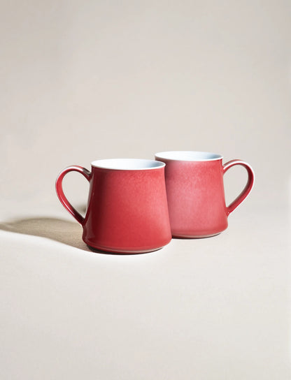 Two SaraGaia peach blossom mugs side-by-side. Unique gradient glaze.