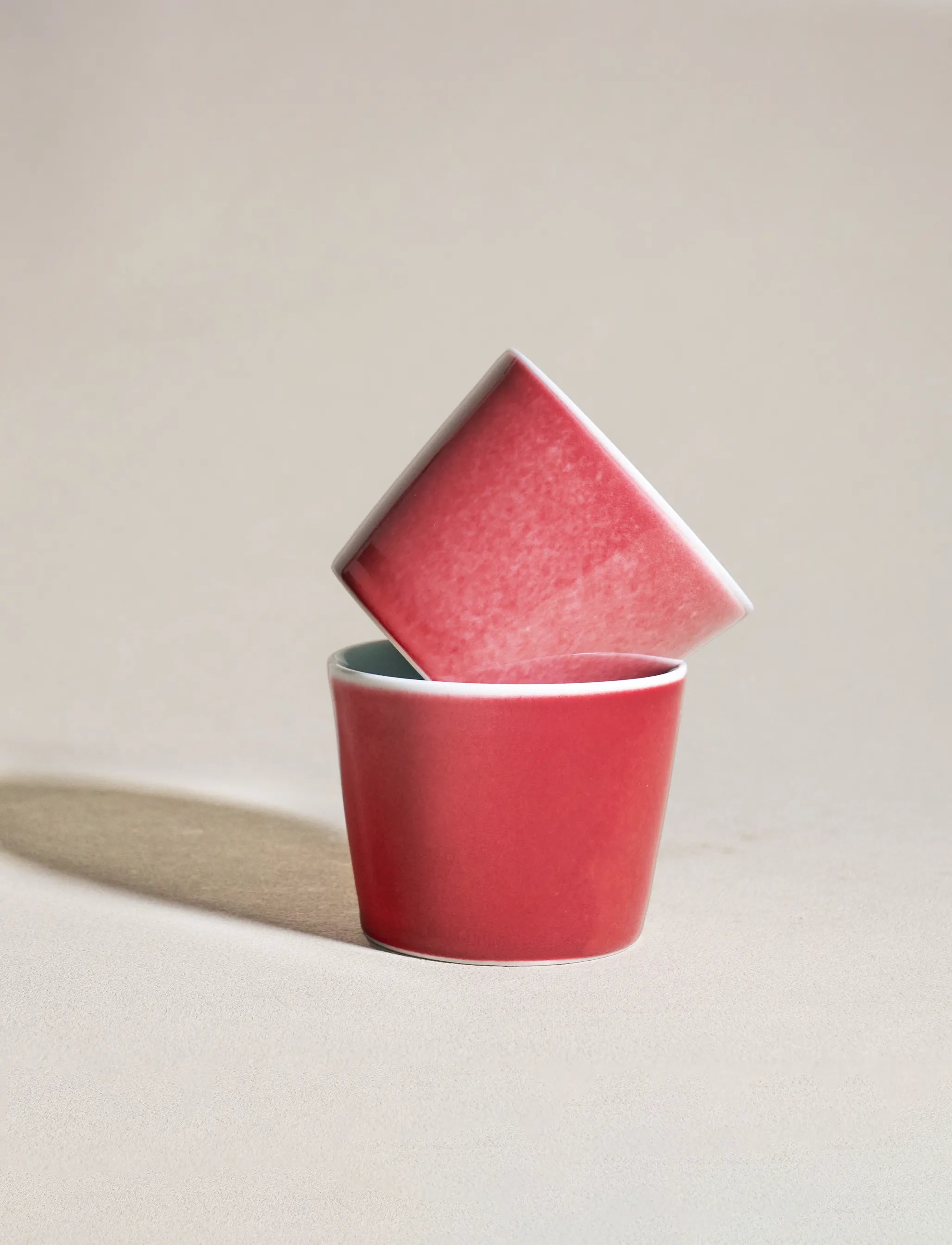 Two 6.8oz SaraGaia cups in an asymmetric stack. Unique handcrafted finish.